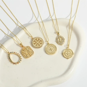Set of six vintage gold religious pendant necklaces with cross and saint medal charms