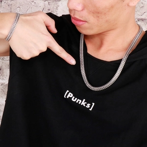 Close-up of men's stainless steel silver flat snake chain necklace and bracelet set