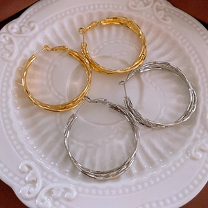Minimalist geometric twisted metal hoop earrings in gold and silver finish for women