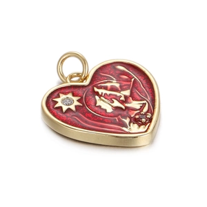 Golden heart pendant with red enamel, star pattern and rhinestone on white background