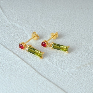 Detail shot of vintage S925 silver earrings with red and green gemstones and S925 mark