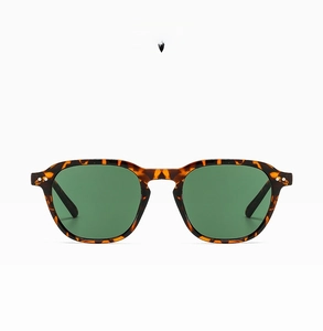 Detail view of vintage tortoise shell sunglasses with G15 lenses and silver rivet studs