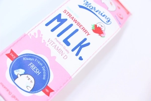 Detail view of the pink strawberry milk carton pencil case with high-quality printing