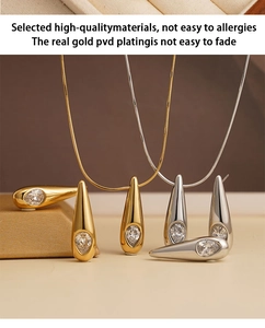 Details von Tropfenschmuck-Set in Gold und Silber mit funkelnden Kristallen