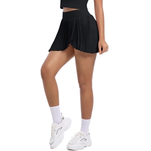 Detail of high-waist black pleated tennis skirt with elastic waistband for athletic wear