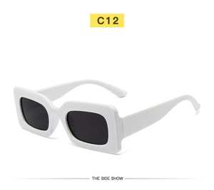Side view of retro rectangular white frame sunglasses with dark lenses and thick temples