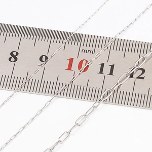 Stainless steel paperclip chain links on a ruler showing 2mm and 5mm width measurements