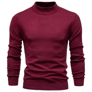 Detailed view of burgundy knit texture and ribbed collar on men's turtleneck sweater