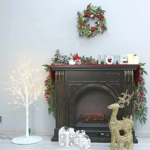 Cozy holiday scene featuring a lit birch tree, gold reindeer, and festive Christmas garland