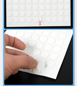 Detailed view of 1cm round double-sided adhesive dots showing easy peeling application