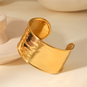 Adjustable wide 18K gold plated stainless steel cuff bracelet with hammered texture finish