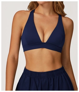 Detailed front view of high-stretch dark blue sports bra with V-neck and halter strap