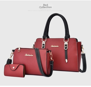 Detailed set of three red synthetic leather bags featuring litchi grain and gold hardware