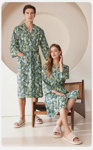 Detail of tropical palm leaf print robes for couples with belt and pocket design
