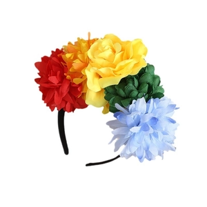 Colorful Bohemian floral headband featuring red, yellow, and blue fabric flowers on black band