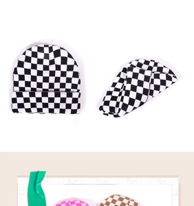 Close-up of checkerboard jacquard knit pattern and soft texture on colorful beanies