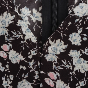 Deep V-neck floral dress back view showing hidden zipper and elegant flared sleeves