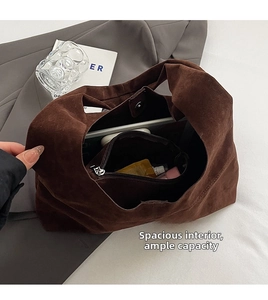 Interior view of brown suede tote bag showing large capacity and internal zipper pocket
