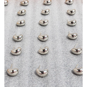 Minimalist silver bean stud earrings with polished metallic finish in a matrix layout