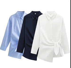 Detail of light blue, navy, and white long sleeve shirts with front knot poplin design