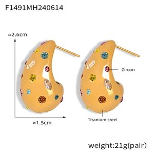 Detail view of teardrop earrings in gold titanium steel with colorful zircon inlay and size specs