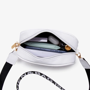 White faux leather crossbody camera bag with wide strap and internal storage view