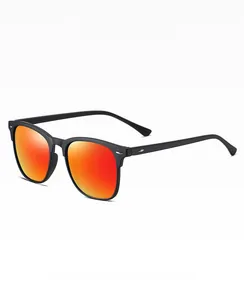 Detail of classic polarized sunglasses with silver rivets and orange mirror lenses