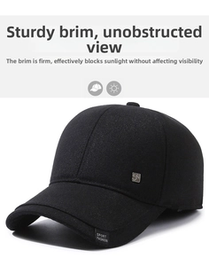 Detail of a black winter baseball cap with ear protection and sport fashion embroidery