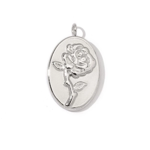 Detailed close-up of a silver stainless steel oval pendant with 3D embossed rose floral design