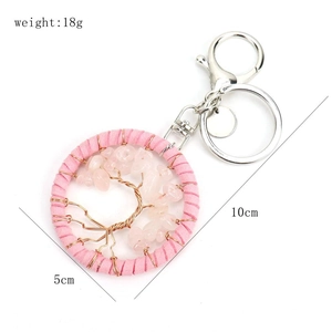 Handmade tree of life keychain with pink crystals and dimensions 5x10cm weight 18g