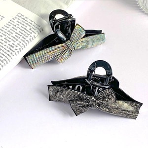 Elegant bow hair claw clips with sparkling rhinestones in black and silver finishes