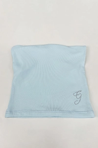 Detail of light blue modal lace camisole featuring a sparkling rhinestone G letter