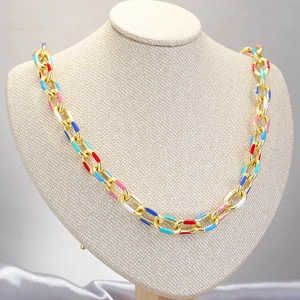 Golden chunky chain necklace with colorful enamel drip oil accents on a mannequin