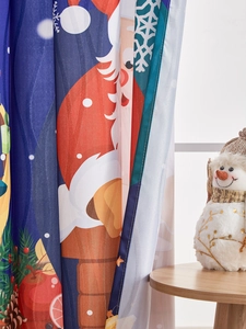 Detail view of American Christmas curtains featuring Santa Claus and snowflake prints