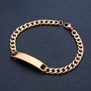 Detailed view of golden stainless steel Cuban chain bracelet with blank engraving plate