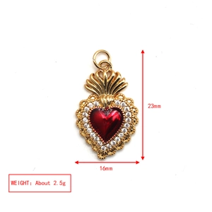 Detailed view of 23mm red heart pendant with gold plating and clear crystal border