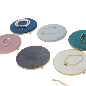 Set of six colorful velvet jewelry trays with gold metal bases for rings and necklaces