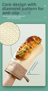Detail of cream silicone oven glove with non-slip diamond texture holding baked food