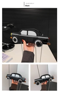 Detail view of a black patent leather car-shaped bag with checkered pattern and chain