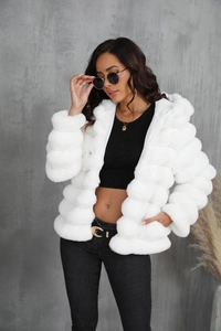 Detailed texture of white faux fur jacket with horizontal stripes and hood design