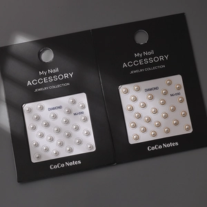 Detailed view of 5D gold embossed nail stickers with pearl accents in MJ-030 style