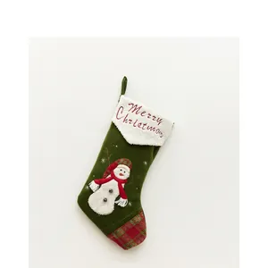 Christmas stocking in dark green velvet with snowman embroidery and Merry Christmas text