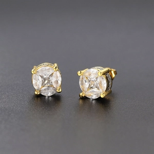 Close-up of gold-plated stud earrings with four-claw set cubic zirconia stones