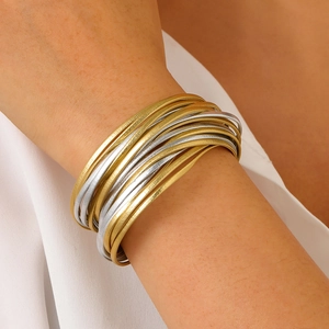 Chic multi-layered gold and silver mixed metal wire bangle set for a minimalist look