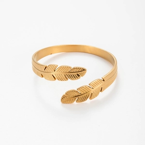 Adjustable gold plated stainless steel open bangle featuring elegant feather design