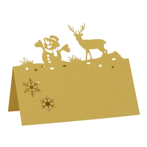 Golden Christmas table name cards with laser-cut reindeer, snowman and snowflake designs