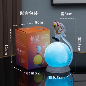 Floating astronaut moon lamp with blue light and creative lunar base in gift box packaging