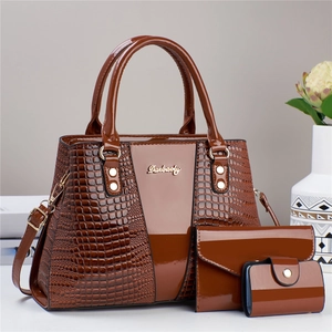 3-piece brown crocodile pattern tote bag set with glossy finish and matching clutch wallets