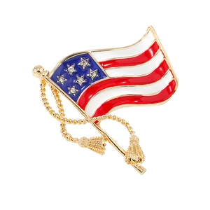 Golden American flag brooch with red white blue enamel and sparkling rhinestones
