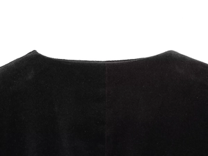 Close-up of the black velvet fabric texture and clean neckline design on the romper